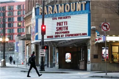  ??  ?? A marque announcing a postponed Patti Smith show is pictured at the Paramount Theater after Washington’s governor, Jay Inslee, banned gatherings of 250 or more in Seattle. Photograph: Jason Redmond/Reuters