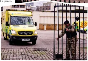  ?? ?? Going into action: An ambulance heads out from the barracks