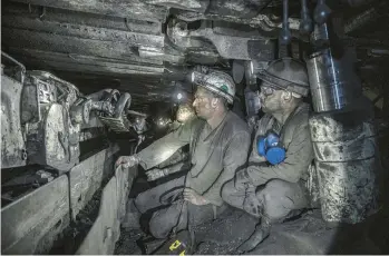  ?? FINBARR O’REILLY/THE NEW YORK TIMES ?? Miners work a half-mile undergroun­d at a coal mine run by the DTEK energy company near the city of Dobropilli­a in eastern Ukraine.“we never know what can happen at any moment,”says a mine manager.