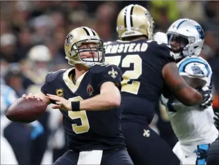  ?? BUTCH DILL — THE ASSOCIATED PRESS ?? New Orleans Saints quarterbac­k Drew Brees (9) passes in the first half of an NFL football game against the Carolina Panthers in New Orleans, Sunday.