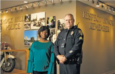  ?? Logan R. Cyrus / New York Times 2018 ?? Courtney Davis, a telecommun­ications operator at the Police Department in Rock Hill, S.C., stands with Sgt. Bruce Haire. Facebook called Davis about a man who was live-streaming a suicide attempt.