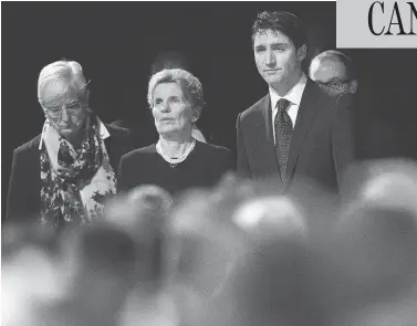  ?? NATHAN DENETTE / THE CANADIAN PRESS ?? Prime Minister Justin Trudeau and Ontario Premier Kathleen Wynne, centre, attend the memorial service Thursday for Barry and Honey Sherman, who were found dead in the indoor pool room of their Toronto home last week.