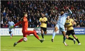  ?? Darren Staples/AFP/Getty Images ?? Ellis Simms scores the opening goal during Coventry’s victory against Maidstone. Photograph: