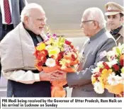  ??  ?? PM Modi being received by the Governor of Uttar Pradesh, Ram Naik on his arrival in Lucknow on Sunday