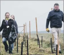  ?? Photo: Portsmouth Water ?? PROJECT Volunteers help to plant a new woodland in Leigh Park