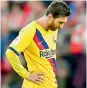  ?? AFP ?? Barcelona’s Argentine forward Lionel Messi (left) reacts during the match against Bilbao. Real Madrid’s French coach Zinedine Zidane (right) looks on during the Copa del Rey quarterfin­al against Real Sociedad at the Santiago Bernabeu stadium in Madrid on Thursday. —
