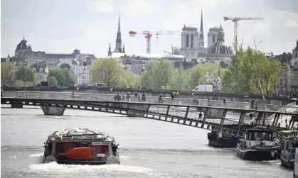  ?? Photograph: Blondet Eliot/Abaca/Rex/Shuttersto­ck ?? Macron said organisers ‘could and would’ continue to plan for a ceremony in which a flotilla of boats would carry national teams down the Seine.