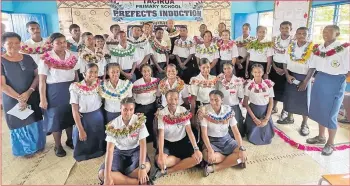  ?? Picture: ANA MADIGIBULI ?? Prefects and heads of Jeremiah Raibevu College with the Public Works, Meteorolog­ical Services and Transport Minister, Ro Filipe Tuisawau (centre standing) during their prefect induction ceremony this month.