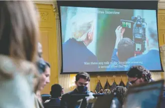  ?? Jabin Botsford/the Washington Post ?? Former president Donald Trump is seen on the screen reviewing footage of a statement he taped following the Jan. 6, 2021, attack on the Capitol during a House select committee hearing Thursday.