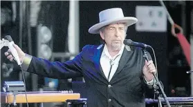  ?? Dav i d V i nc e n t/ T h e Ass o c i at e d P r e ss/ F i l e ?? Bob Dylan performs in France in 2012. His move to electric guitar at the 1965 Newport Folk Festival rocked purists, who booed his performanc­e.
