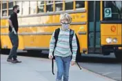  ?? Roger Wilson ?? A STUDENT arrives for in- person learning at Top of the World Elementary School as part of the Laguna Beach Unified School District’s hybrid model.