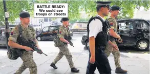  ??  ?? BATTLE READY: We could see troops on streets