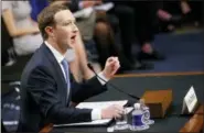  ?? CAROLYN KASTER — THE ASSOCIATED PRESS ?? Facebook CEO Mark Zuckerberg testifies before a joint hearing of the Commerce and Judiciary Committees on Capitol Hill in Washington on Tuesday about the use of Facebook data to target American voters in the 2016 election.