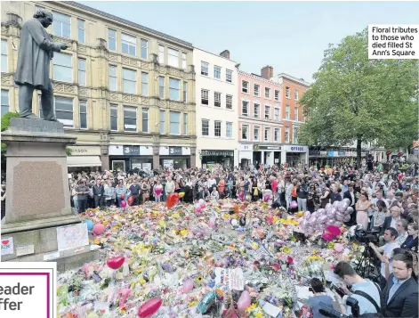  ??  ?? Floral tributes to those who died filled St Ann’s Square