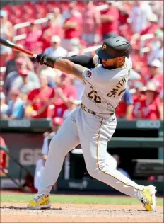  ?? Dilip Vishwanat/Getty Images ?? Canaan Smit-Njigba doubles for his first career hit in the ninth inning of Game 1 of a doublehead­er Tuesday in St. Louis.