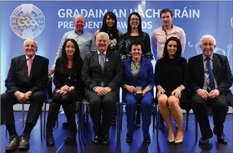  ??  ?? Margaret Leacy with family members after receiving her award from G.A.A. President Aogán O Fearghail (centre front) in Croke Park.