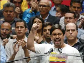  ?? ARIANA CUBILLOS, THE ASSOCIATED PRESS ?? National Assembly first Vice President Freddy Guevara speaks to the press accompanie­d by fellow lawmakers in Caracas, Venezuela, on Monday.