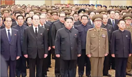  ?? KCNA/AFP ?? North Korean leader Kim Jong-un (centre) attending the memorial service for leader Kim Jong-il at the Kumsusan Palace of the Sun in Pyongyang on Saturday, the fifth anniversar­y of his demise.