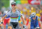  ?? AP ?? Slovakia’s Peter Sagan of (C) crosses the finish line ahead of Ireland's Daniel Martin (R) to win the 3rd stage of Tour de France.