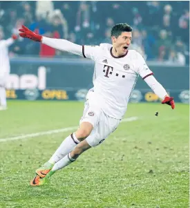  ??  ?? Bayern Munich’s Robert Lewandowsk­i celebrates his winner against Freiburg.