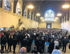  ??  ?? Police officers brief politician­s, journalist­s and staff at the Houses of Parliament in Westminste­r Hall, after the entire complex was locked down