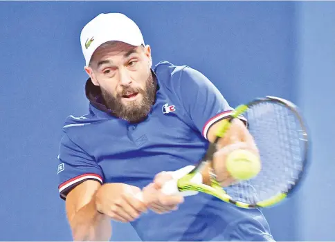  ?? — AFP photo ?? French player Benoit Paire returns the ball to Spanish player Pablo Carreno Busta during the Davis Cup semi-final tennis match between France and Spain in Villeneuve-d’Ascq, northern France, on September 14, 2018.