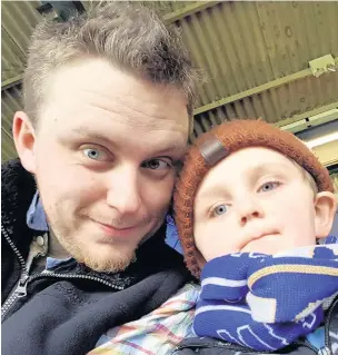  ??  ?? Macclesfie­ld Town fan Chris O’Neill with his son Michael, five