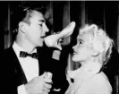  ?? Photograph: Stephen Black/Archive Photos via Getty Images ?? Mickey Hargitay drinks champagne from the shoe of Jayne Mansfield at their wedding at the Wayfarers Chapel on 13 January 1958.