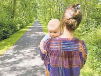  ?? COURTESY OF THOMAS LANNON ?? Farrar Lannon takes a walk with her daughter Una, who was born March 12 at St. Luke’s Hospital.