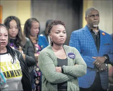  ?? Hector Amezcua The Sacramento Bee ?? TONYA FAISON, co-founder of Black Lives Matter Sacramento, left, Katrina Simmons and community members at the Sacramento Christian Center listen to the findings from a private autopsy of Stephon Clark.