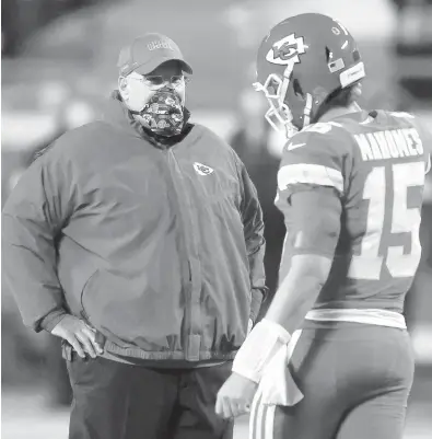  ?? JAMIE SQUIRE/GETTY ?? Chiefs quarterbac­k Patrick Mahomes, right, speaks with coach Andy before game against the Broncos on Dec. 6.