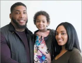  ?? MARK LENNIHAN — THE ASSOCIATED PRESS FILE ?? In this file photo, Houston Texans defensive end Devon Still and his fiancee Asha Joyce pose with their daughter, Leah, 5, in New York. Still retired from football and started his second career, trying to help families cope with childhood cancer. He’s...