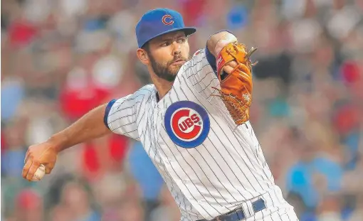  ?? | JONATHAN DANIEL/GETTY IMAGES ?? Starting pitcher Jake Arrieta (4-1, 2.05 ERA), who took a perfect game into the seventh inning Tuesday, is 8-3 in 19 starts with the Cubs.