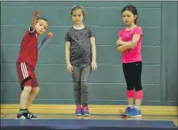  ??  ?? Boys and girls take part in the javelin event.