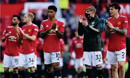  ?? Photograph: Laurence Griffiths/Reuters ?? Manchester United players on last season’s lap of appreciati­on after the match against Fulham.