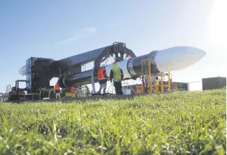  ??  ?? The electron rocket being transporte­d to a launch pad prior to liftoff at the Rocket Lab Launch Complex 1 on the Mahia Peninsula, North Island, New Zealand.