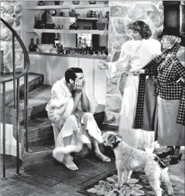  ?? CLASICO/ALAMY STOCK PHOTO ?? Cary Grant and Katharine Hepburn in the 1938 film Bringing Up Baby, where Grant used the word ‘gay’ on screen. Opinion is divided though, on whether he used it to mean homosexual or happy and cheerful.CINE