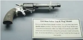  ??  ?? The butt of the Colt New Police ‘Cop and Thug’ model revolver shows a policeman grappling with a knife-wielding thug.