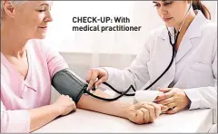  ??  ?? CHECK-UP: With medical practition­er