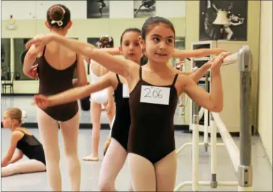  ?? PHOTOS BY LAUREN HALLIGAN — LHALLIGAN@DIGITALFIR­STMEDIA.COM ?? Girls practicing before auditionin­g for roles in George Balanchine’s Firebird with the New York City Ballet this summer at Saratoga Performing Arts Center.