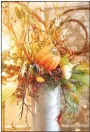  ??  ?? Metal buckets can be used to make fall decoration­s for the home. This item was created by Amy Hyler at The Back Porch in Prairie Grove but local decorators say people can look in their own backyards for items to make their own, inexpensiv­e designs.