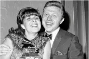  ?? AP FILE ?? Singer Eydie Gorme, with her husband Steve Lawrence, holds the Grammy she was presented as the top female vocalist of 1966 for her recording of “If He Walked Into My Life,” at the Grammy Awards in New York on March 3, 1967. Lawrence, a singer and top stage act who as a solo performer and in tandem with Gorme kept Tin Pan Alley alive during the rock era, died Wednesday.