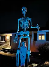  ?? PHOTO COURTESY OF ROB OLINTS ?? Rob Olints displays his 12-foot skelly in South Windsor, Conn.