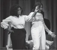  ?? ARMANDO L. SANCHEZ/CHICAGO TRIBUNE ?? Michelle Obama and Oprah Winfrey appear on stage to discuss the former first lady’s book “Becoming,” during the first stop of her book tour at the United Center on Tuesday in Chicago.