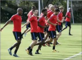  ?? JOHN RAOUX — THE ASSOCIATED PRESS ?? United States soccer players loosen up during a soccer training session, Monday in Sanford, Fla. The United States hosts Panama in a World Cup qualifying match on Friday, Oct. 6.