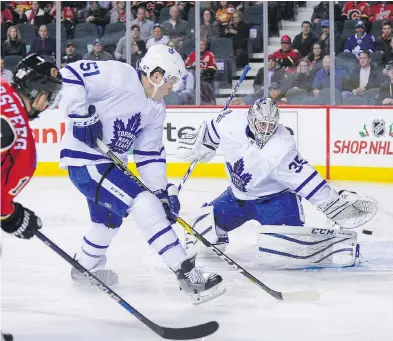  ?? DEREK LEUNG / GETTY IMAGES ?? Kris Versteeg of the Calgary Flames shoots the puck past Toronto Maple Leafs’ backup goaltender Jhonas Enroth during NHL action in Calgary on Wednesday. Enroth has yet to win in four starts this season.