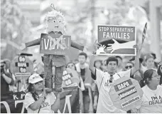  ?? DAVID MCNEW, GETTY IMAGES ?? A protest in May in Los Angeles against Donald Trump.