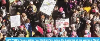  ??  ?? NEW YORK: People gather near Central Park before the beginning of the Women’s March yesterday. — AFP