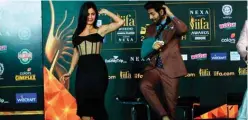 ??  ?? Bollywood actors Katrina Kaif (left) and Kartik Aaryan dance on stage as they attend the Internatio­nal Indian Film Academy (IIFA) press Conference for the 21st Edition of NEXA IIFA Weekend & Awards 2020, in Mumbai. — AFP