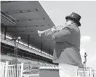  ?? SETH WENIG/AP ?? Bugler Sam Grossman plays to an empty grandstand before the first race Saturday at Belmont Park in New York.